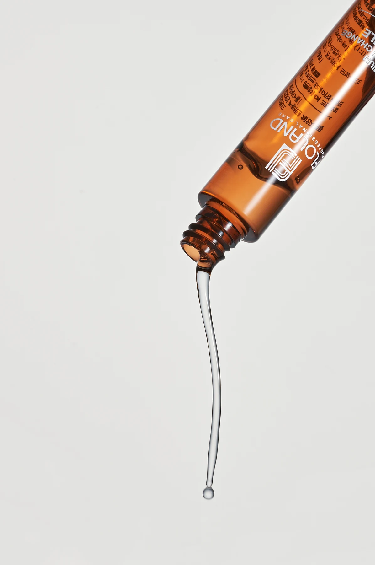 Actual clear ampoule texture flowing from the bottle